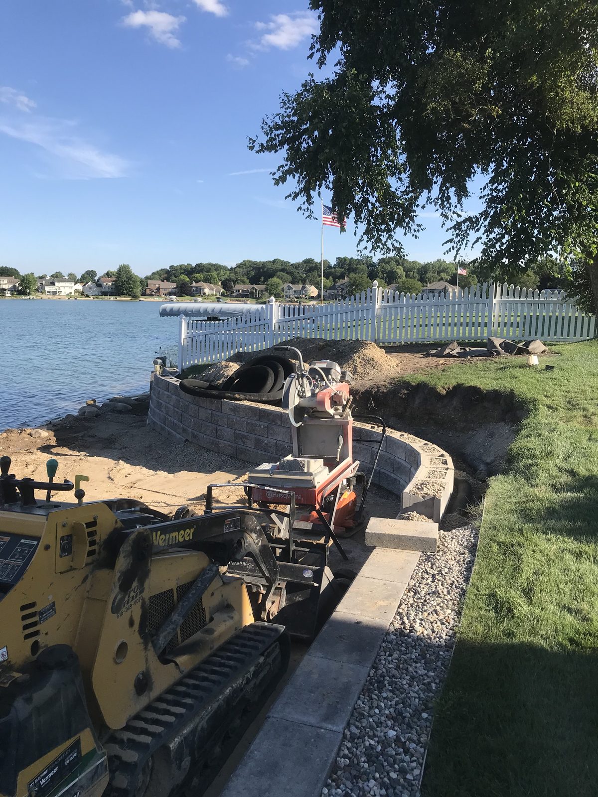 Block seawall installation with Vermeer equipment on a West Michigan inland lake