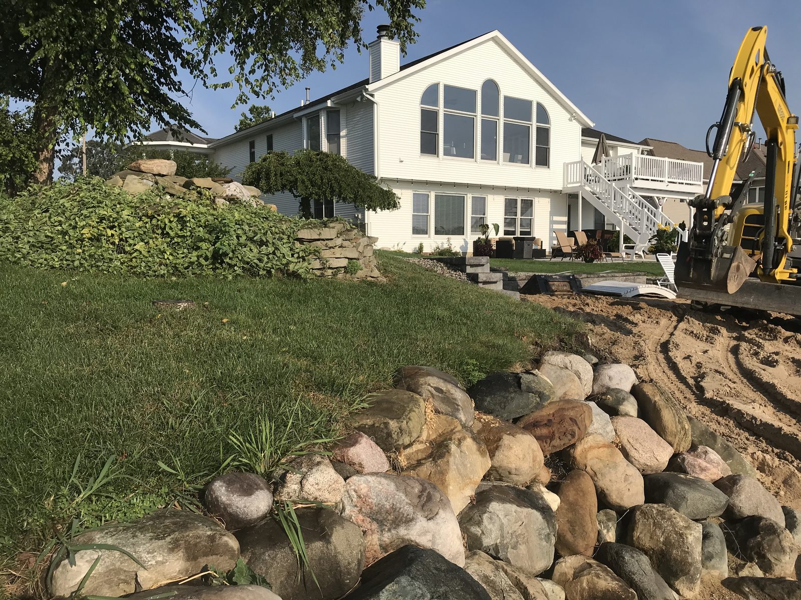 Completed boulder ledgerock seawall protecting a West Michigan lakefront home